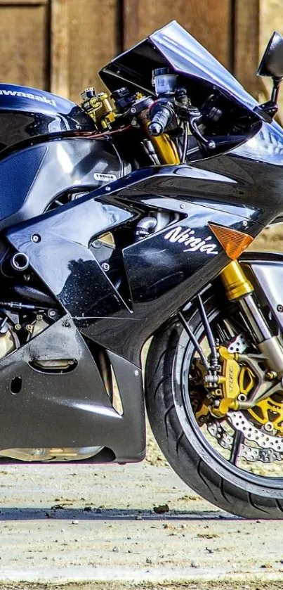 Sleek black motorcycle against a rustic backdrop.