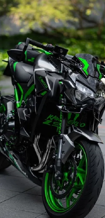 Sleek black motorcycle with green accents on a road.