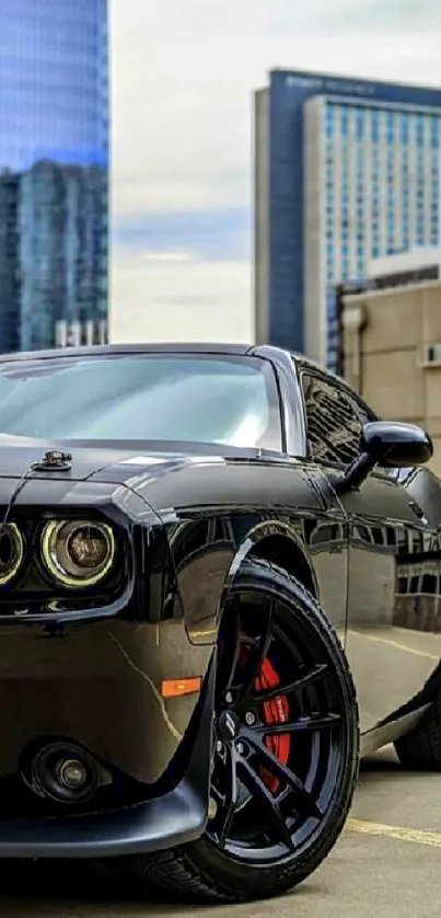 A sleek black muscle car parked in a city with skyscrapers in the background.