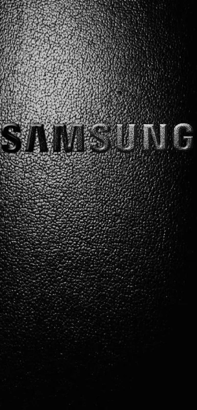 Sleek black Samsung wallpaper with textured surface.