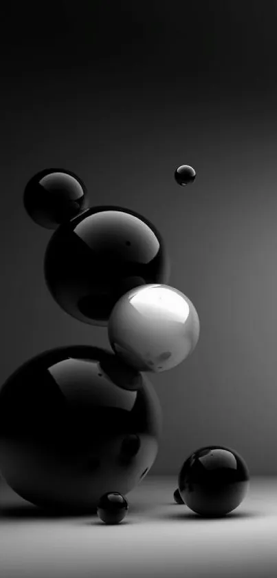 Sleek black spheres wallpaper for mobile phone, featuring glossy orbs.