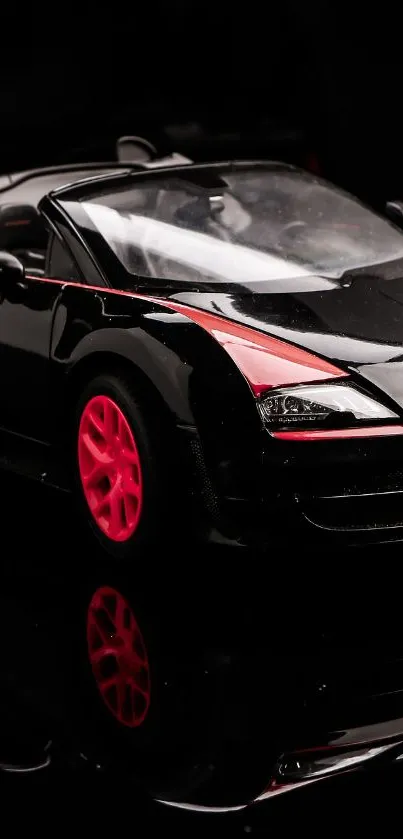 Sleek black sports car with red accents and glossy finish wallpaper.