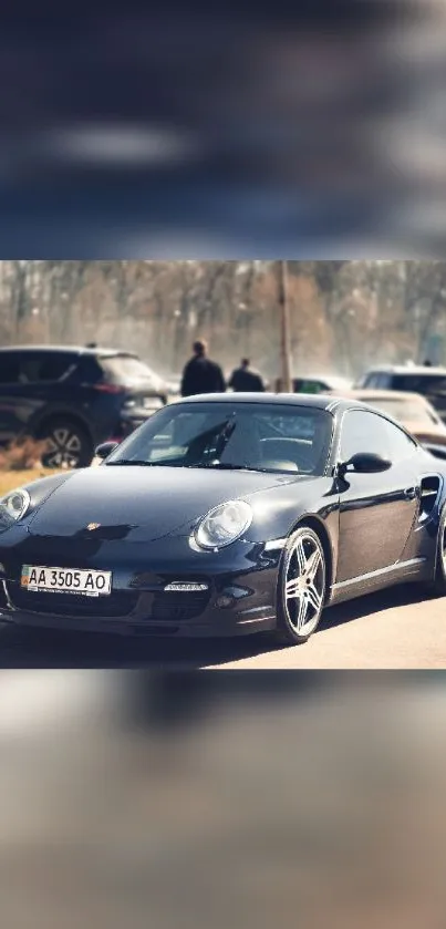 A sleek black sports car parked on a sunny day, showcasing elegance and speed.