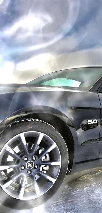 Sleek black sports car on icy terrain with a vibrant sky backdrop.