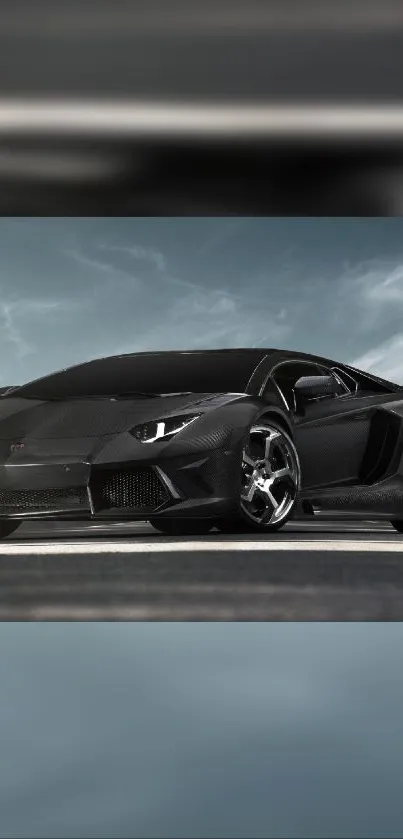 Sleek black sports car under a cloudy sky.