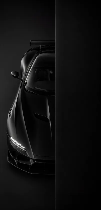 Sleek black sports car on dark background.