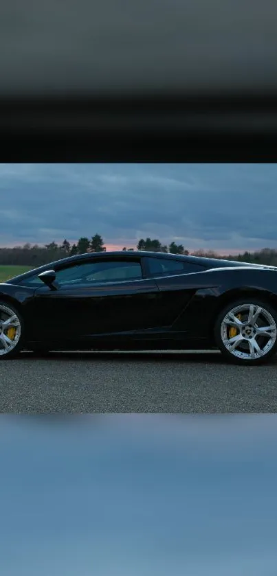 Sleek black sports car on a scenic road.