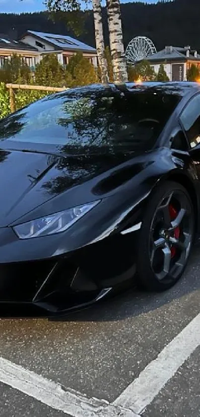 Sleek black sports car parked at night.