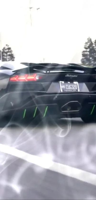 Sleek black sports car driving on a road with tail lights glowing.