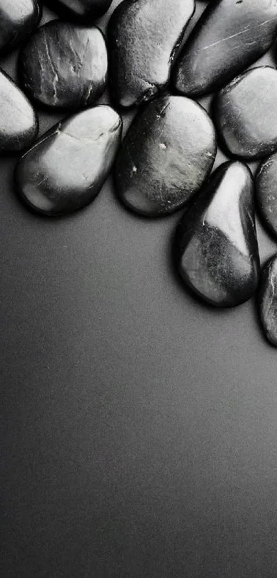 Sleek minimalist wallpaper with polished black stones on top.