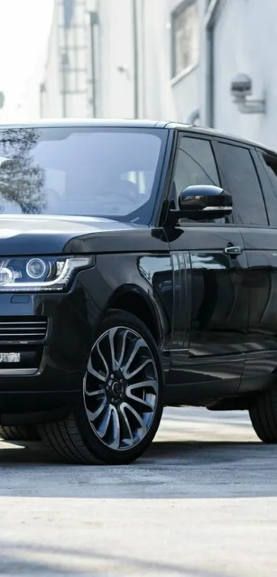 A sleek black SUV parked in a modern urban setting.