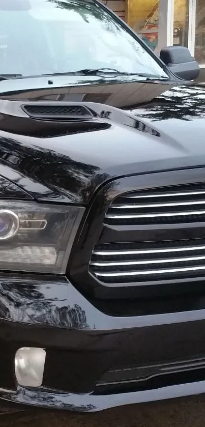 Close-up of a sleek black truck with chrome detailing.