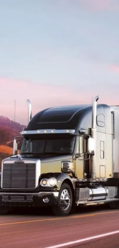 Black semi-truck driving on a scenic highway at sunset.