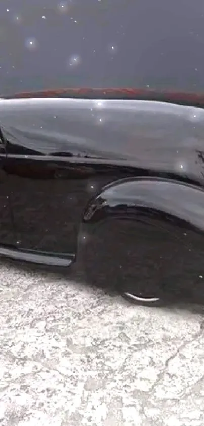 Sleek black vintage car with aerodynamic design on a grey background.