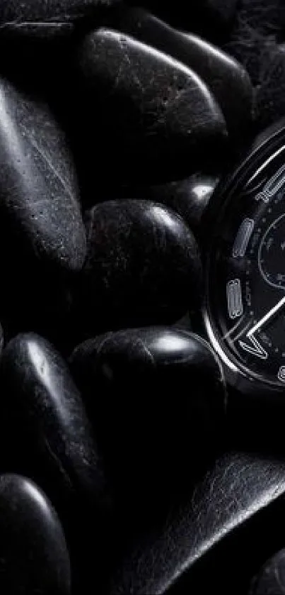 A sleek black watch resting on shiny black stones.