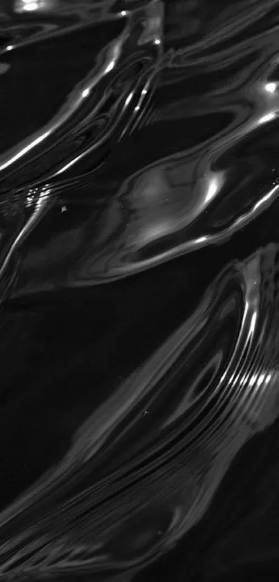 Sleek black water texture with abstract ripples and reflective surfaces.