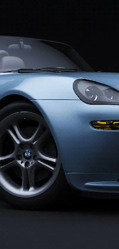 Sleek blue convertible car on a dark background.