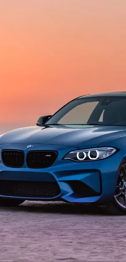 Blue sports car parked on beach at sunset.