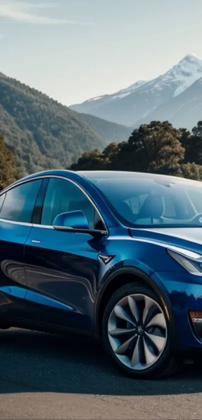 A sleek blue car with mountains in the background.