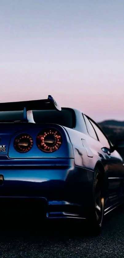 Sleek blue sports car on an open road at dusk.