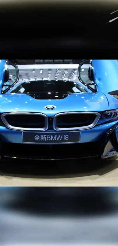 Blue BMW i8 with open doors in a showroom display.