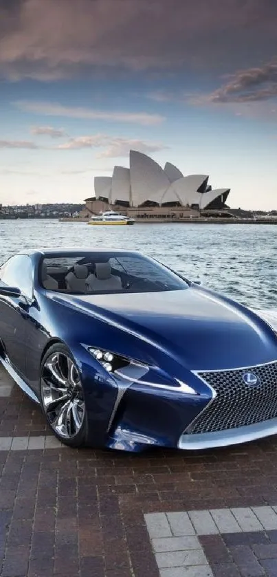 Blue sports car in front of Sydney Opera House, under a dynamic sky.