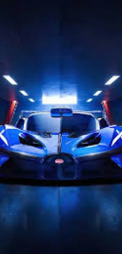 Sleek blue sports car with lights in a dark garage wallpaper.