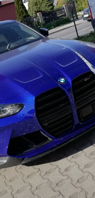 Blue sports car parked in urban area.