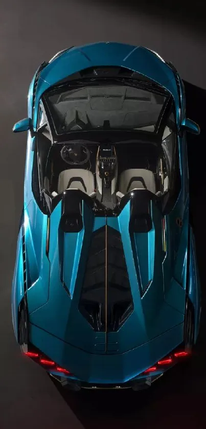 Top view of a sleek blue sports car on a dark background.