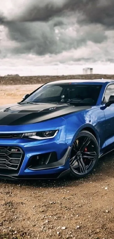 Blue sports car on a rustic backdrop with stormy sky.