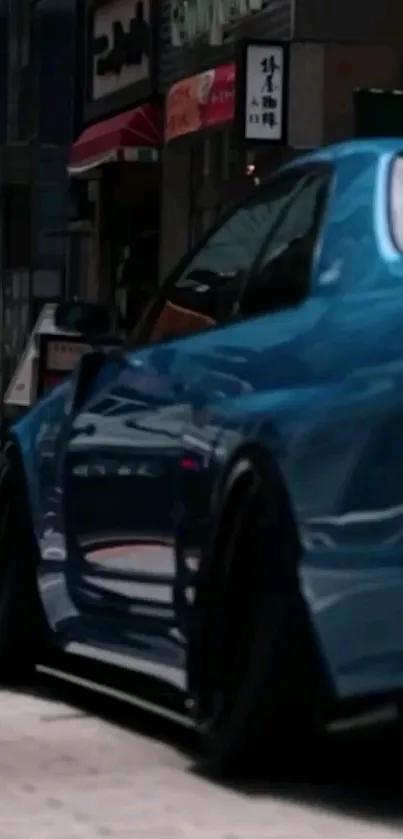 Sleek blue sports car on city street at night.