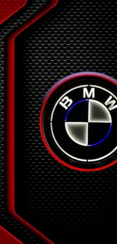 BMW logo on carbon fiber with red accents wallpaper.