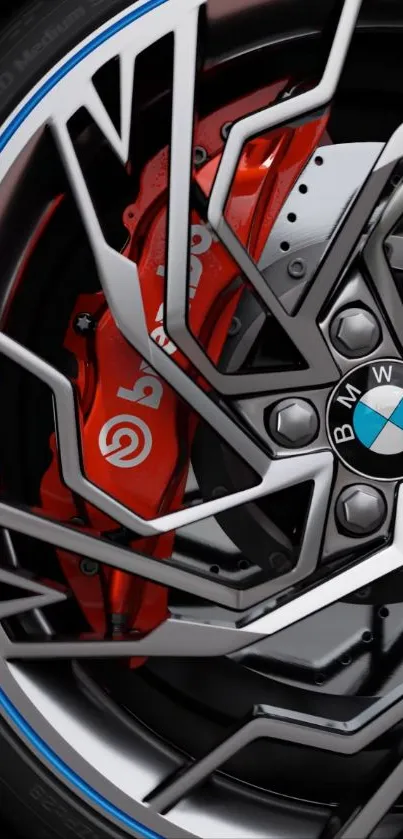 Close-up of BMW wheel with red brake caliper.