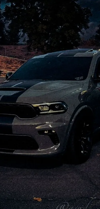 Sleek SUV under a dramatic nighttime sky.