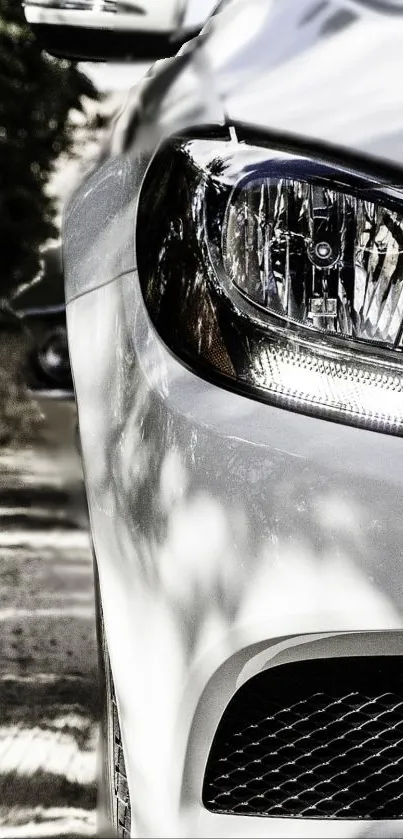 Close-up of luxury car highlighting sleek design and modern headlight.