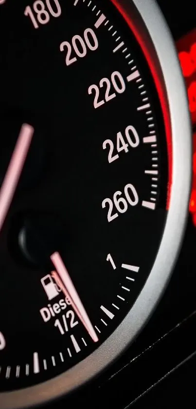 Car dashboard wallpaper with speedometer and red backlights.