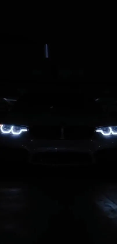 Car headlights piercing through darkness.