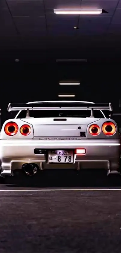 Rear view of a car in an urban parking garage with lights reflecting.