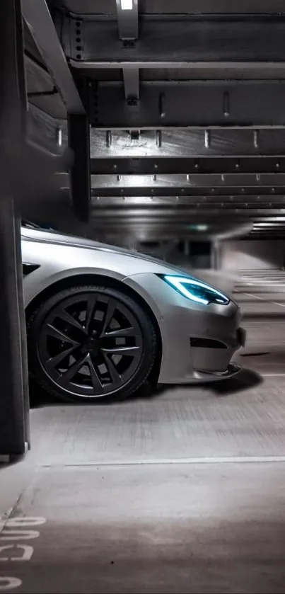 Sleek silver car with blue headlights in a modern parking garage.