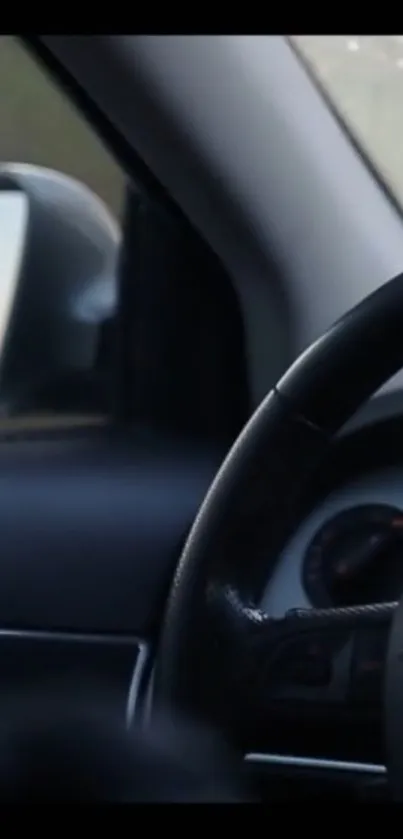 Sleek car interior with steering wheel and mirror reflection.