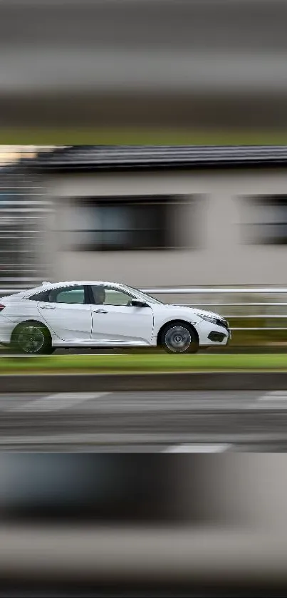 Sleek white car in motion, blurry background.