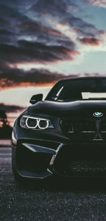 Sleek car silhouette against a dark blue night sky.