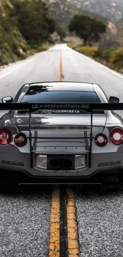 Sleek sports car on a deserted mountain road.