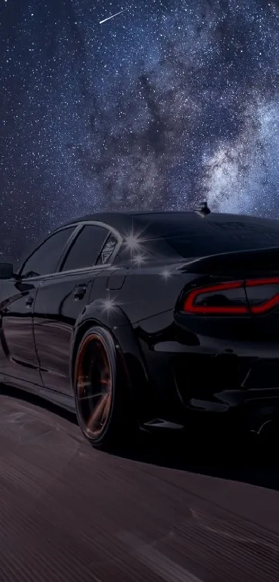 Sleek black car driving under a starry night sky.