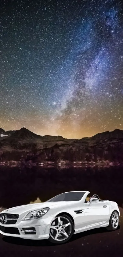 White sports car under a starry night sky with mountains.