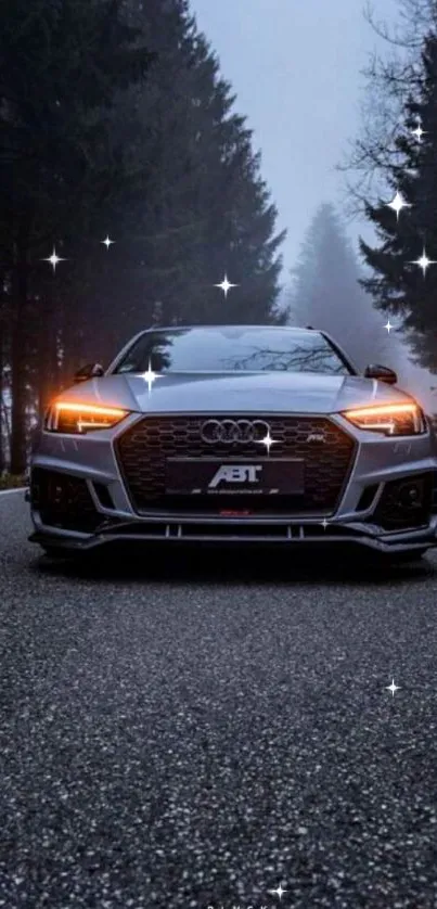 Sleek car on misty forest road under starry sky.