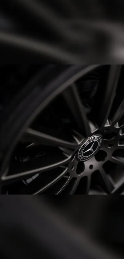 Close-up of a sleek metallic car wheel, perfect for automotive wallpaper.