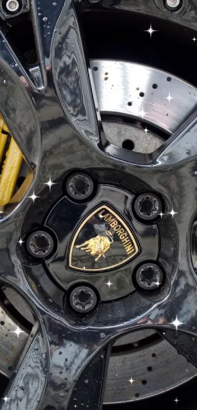 Close-up of a luxury car wheel with black rim and yellow brake caliper.