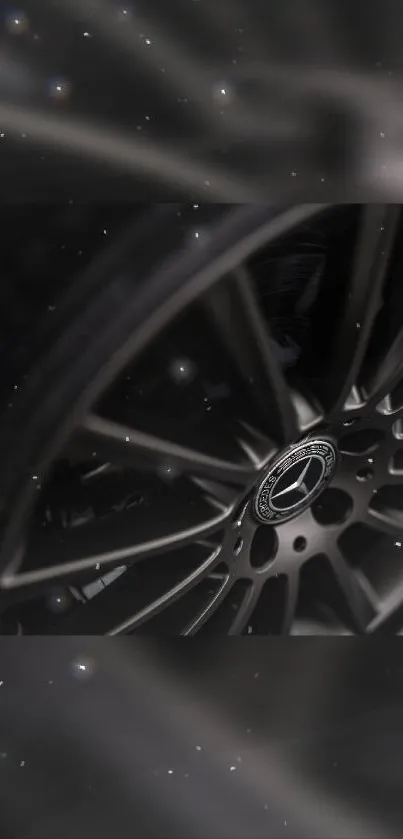 Sleek black car wheel design wallpaper for mobile.