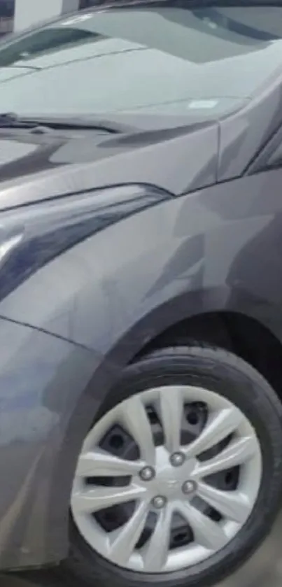 Sleek car wheel close-up wallpaper in gray tones.